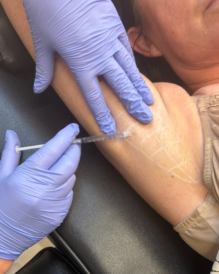 Injectable treatment being administered